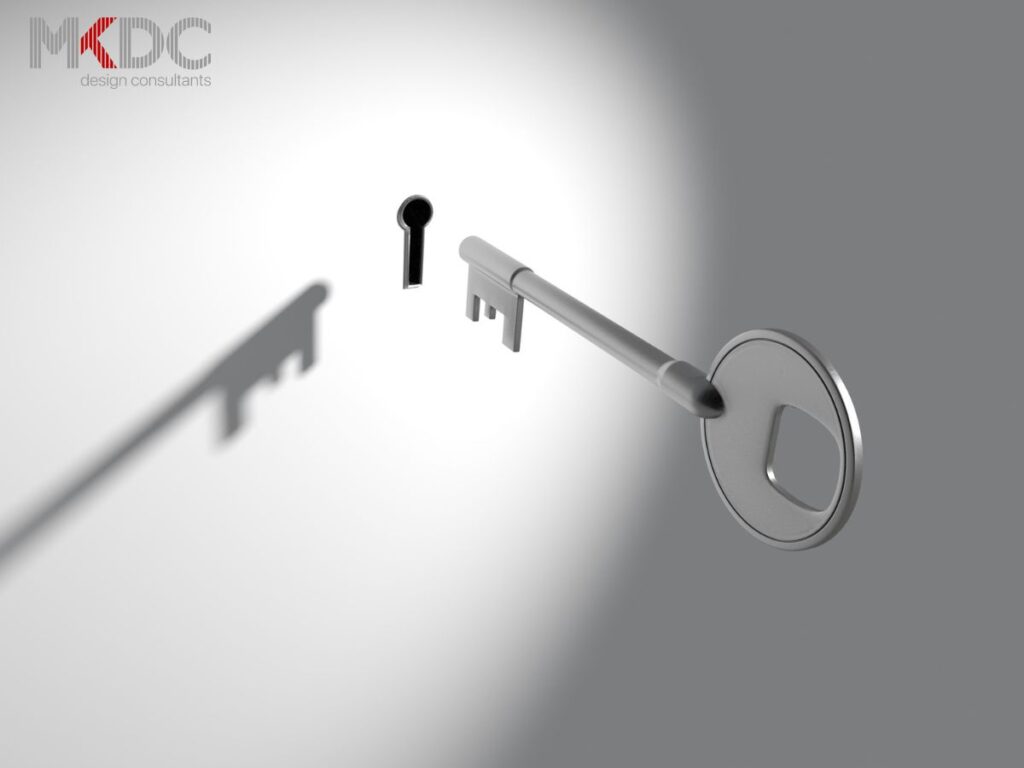 A metallic key approaching a keyhole, casting a shadow.